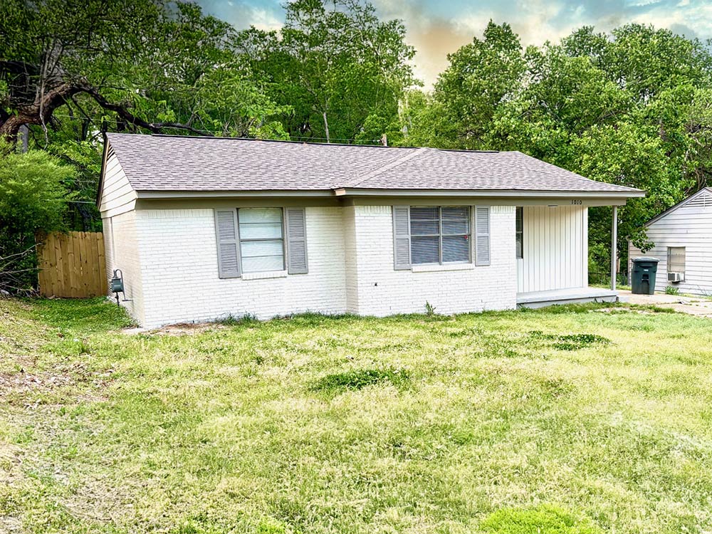 Spacious living room with new flooring and fresh paint in Memphis rental home