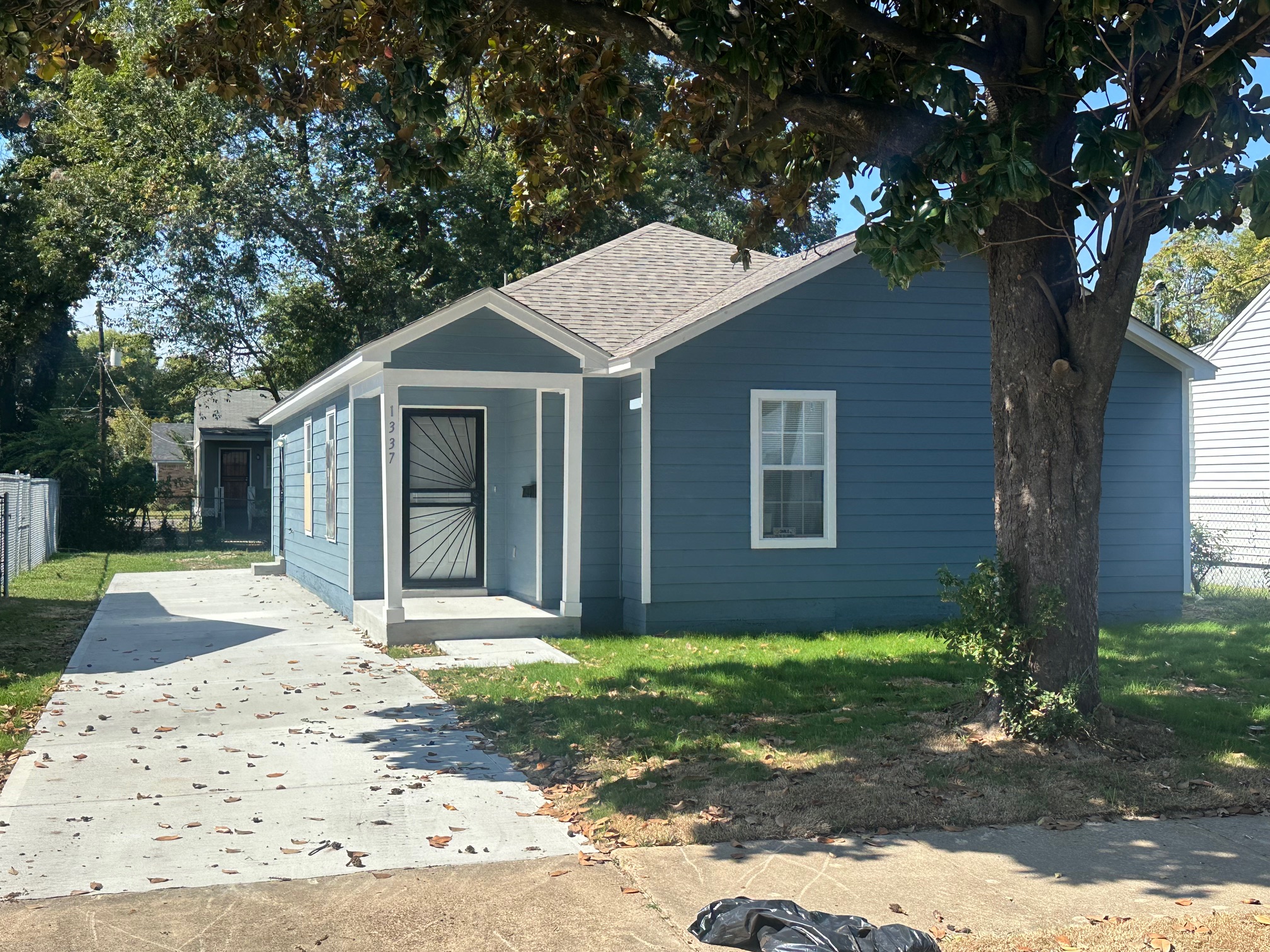 Front Exterior of Brand New Construction Home in Memphis 38108 with fresh paint and new driveway