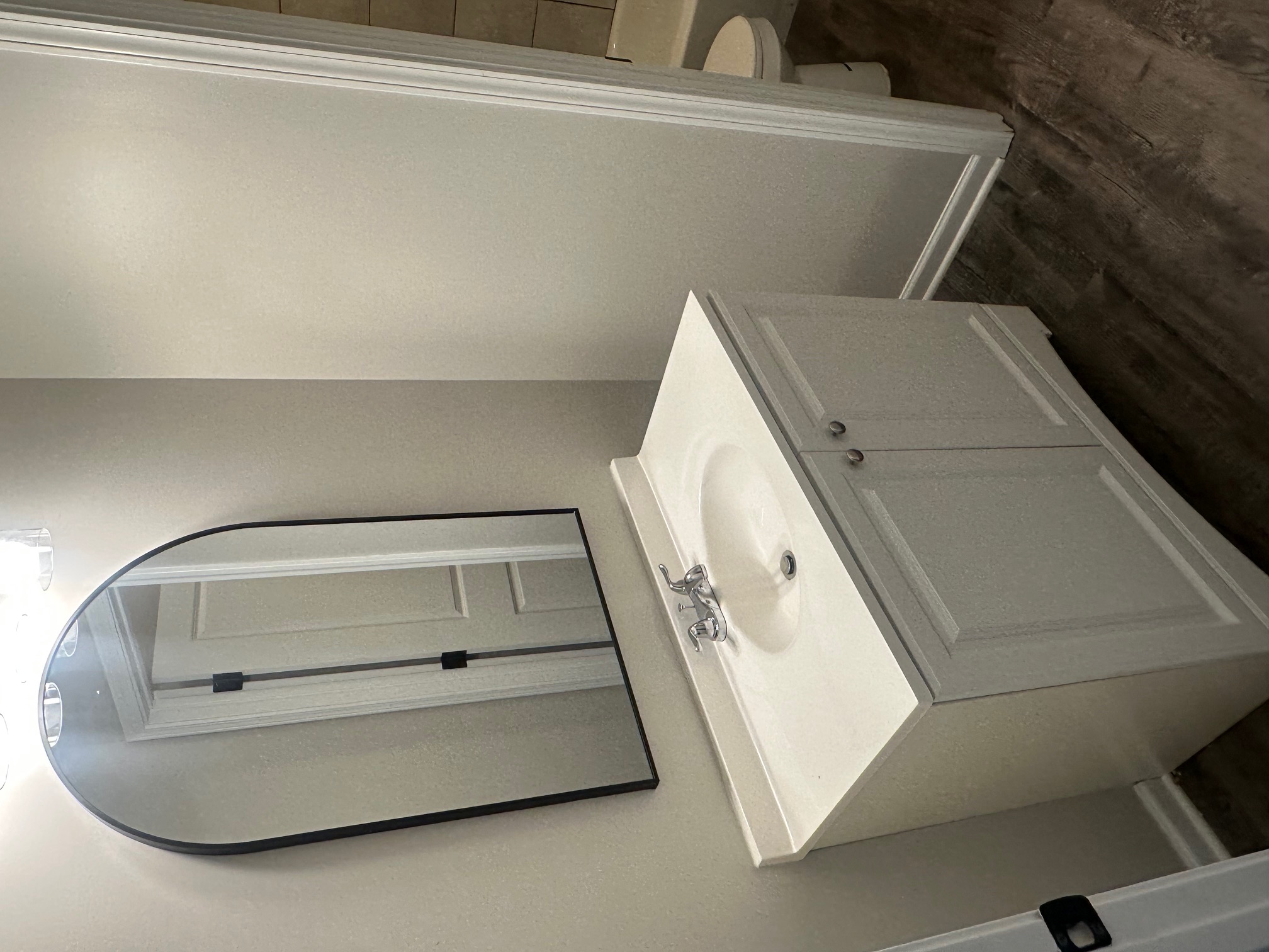 Spacious bedroom with neutral walls, closet space, and natural light in Memphis home for sale