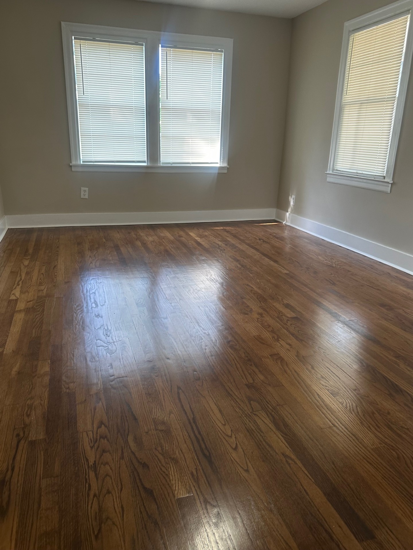 Multi-purpose room with fresh paint, overhead lighting, and modern tile flooring