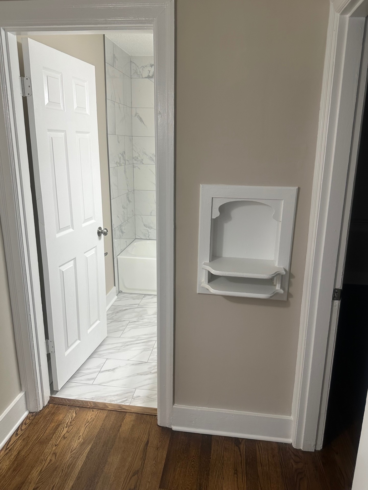 Full front view of house with grass lawn and trees on a sunny day