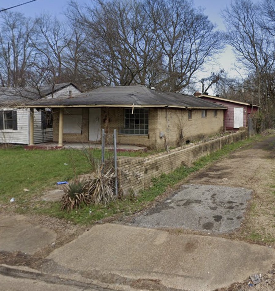 Front exterior of brick house at 2356 Dexter Ave, Memphis 38108 in need of renovation