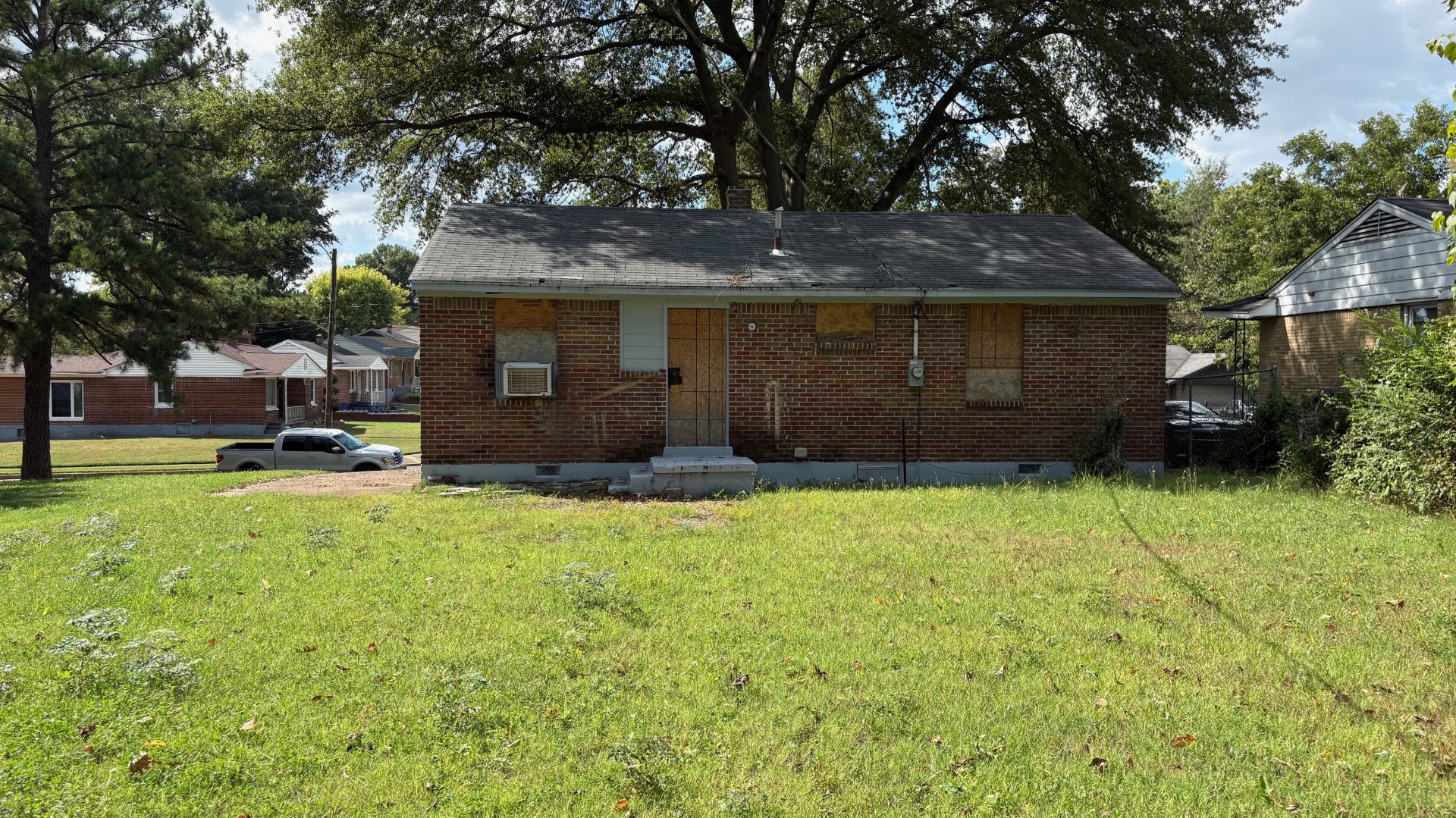 Rear exterior of Memphis TN 38106 home with renovation potential