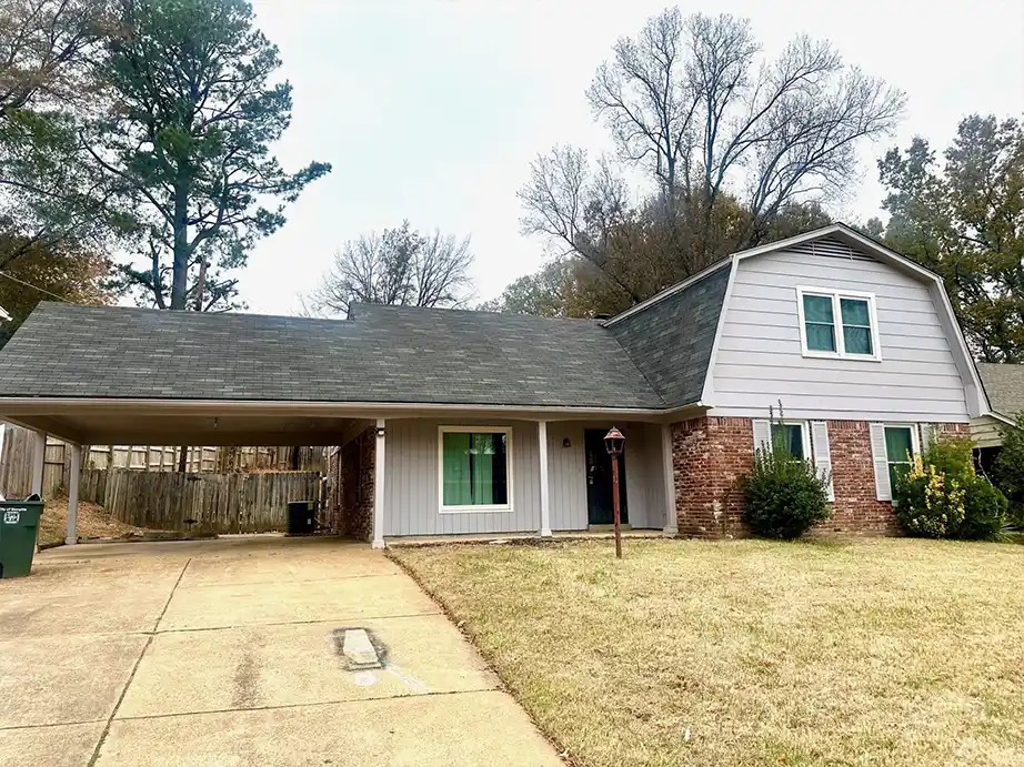 Second upstairs bedroom with original hardwood floors in Memphis fixer-upper
