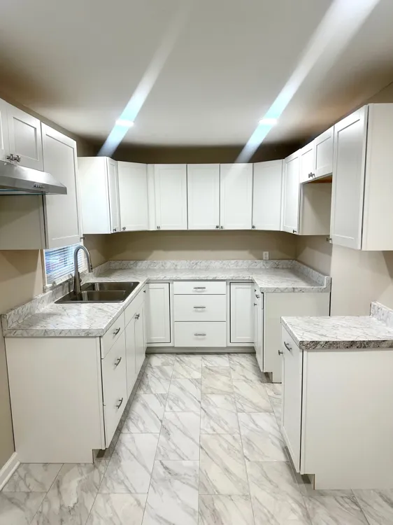Dining area with tile flooring and large window in Memphis rental property