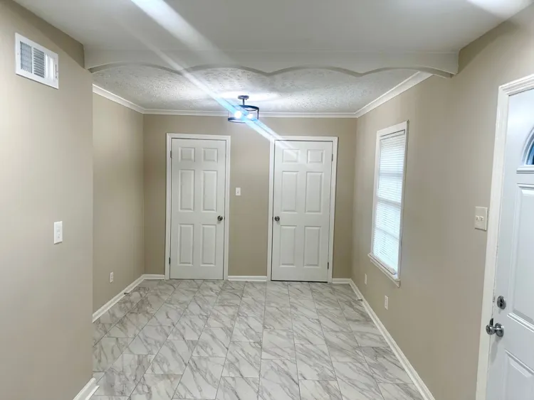 Bright living room with refinished hardwood floors in 38127 home for sale