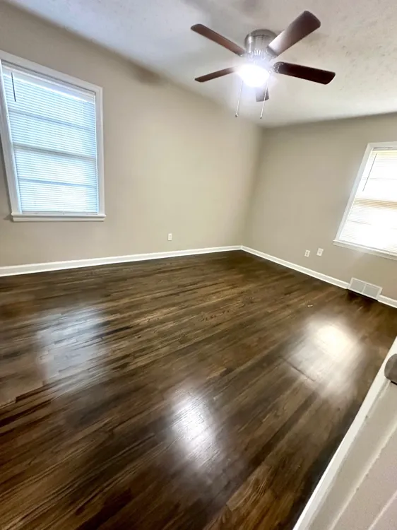 Second bedroom with ceiling fan and updated flooring Memphis property 38127