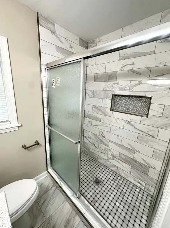 Second bathroom with updated finishes and tiled shower surround in Memphis rental