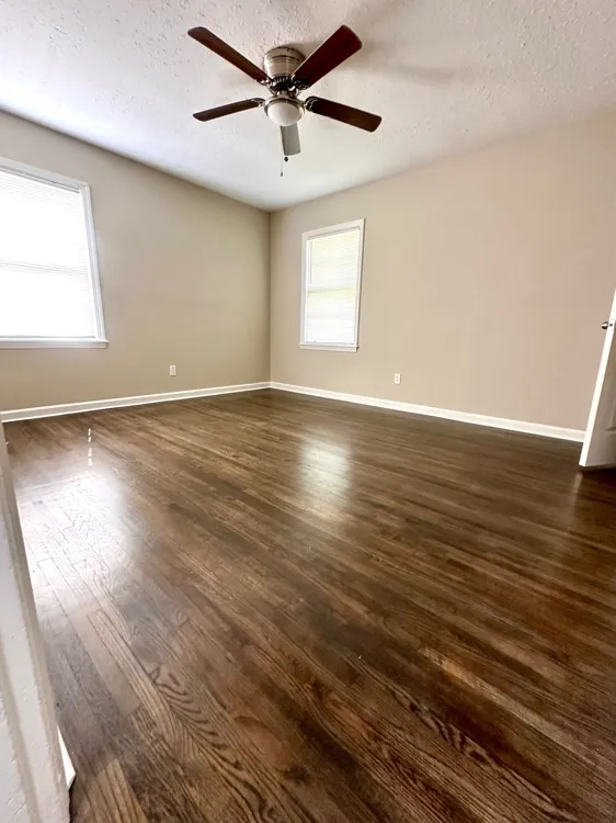 Backyard view with mature trees and large corner lot in Memphis TN 38127