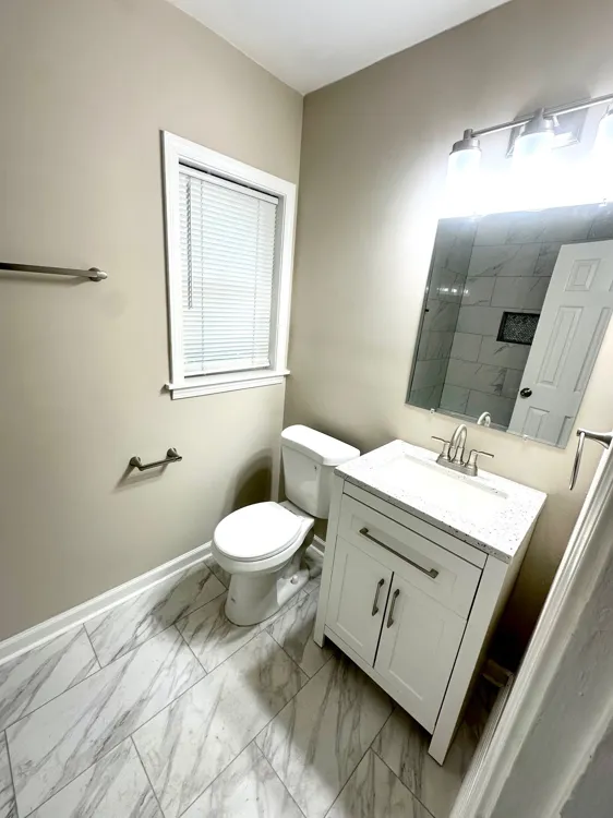 Updated tub and shower combination with ceramic tile surround in Memphis home