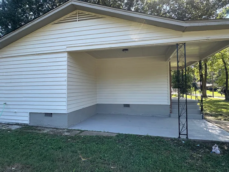 Vertical rear exterior view showing large lot and side gate access Memphis TN
