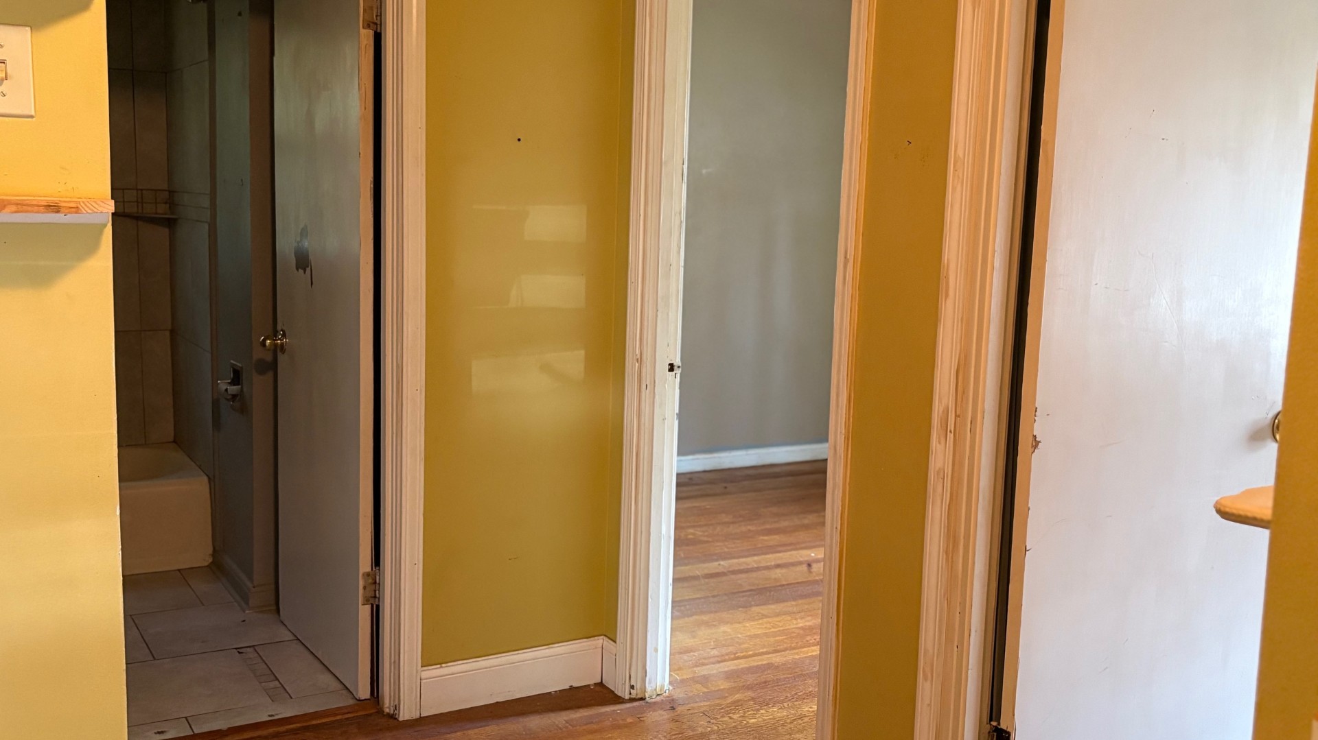 Hallway leading to bedrooms and bath