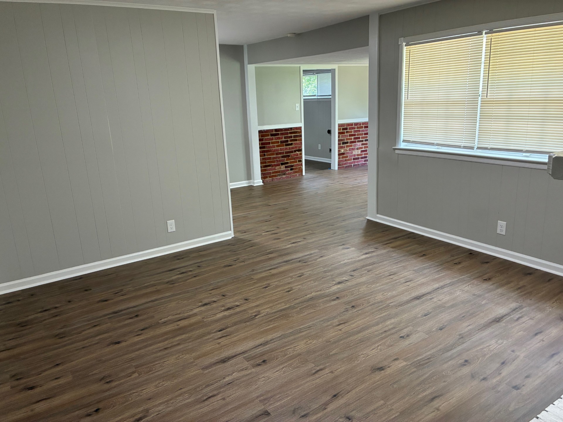 Spacious Living Room with Refinished Hardwood Floors in Memphis Home