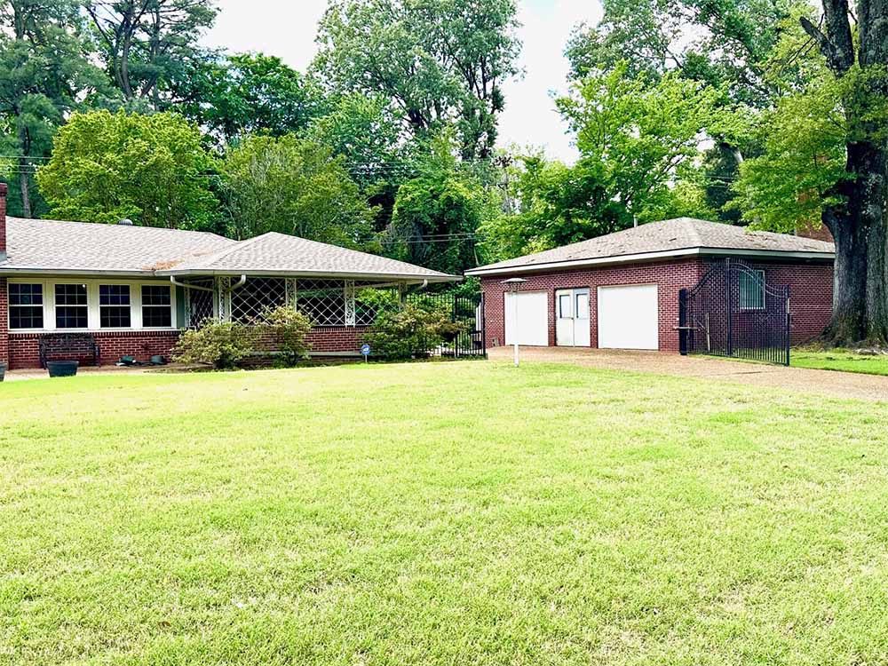 Detached shop and workshop space behind garage in East Memphis home