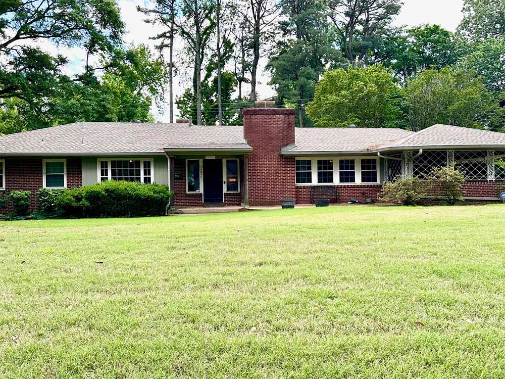 Large backyard with privacy fence and mature landscaping