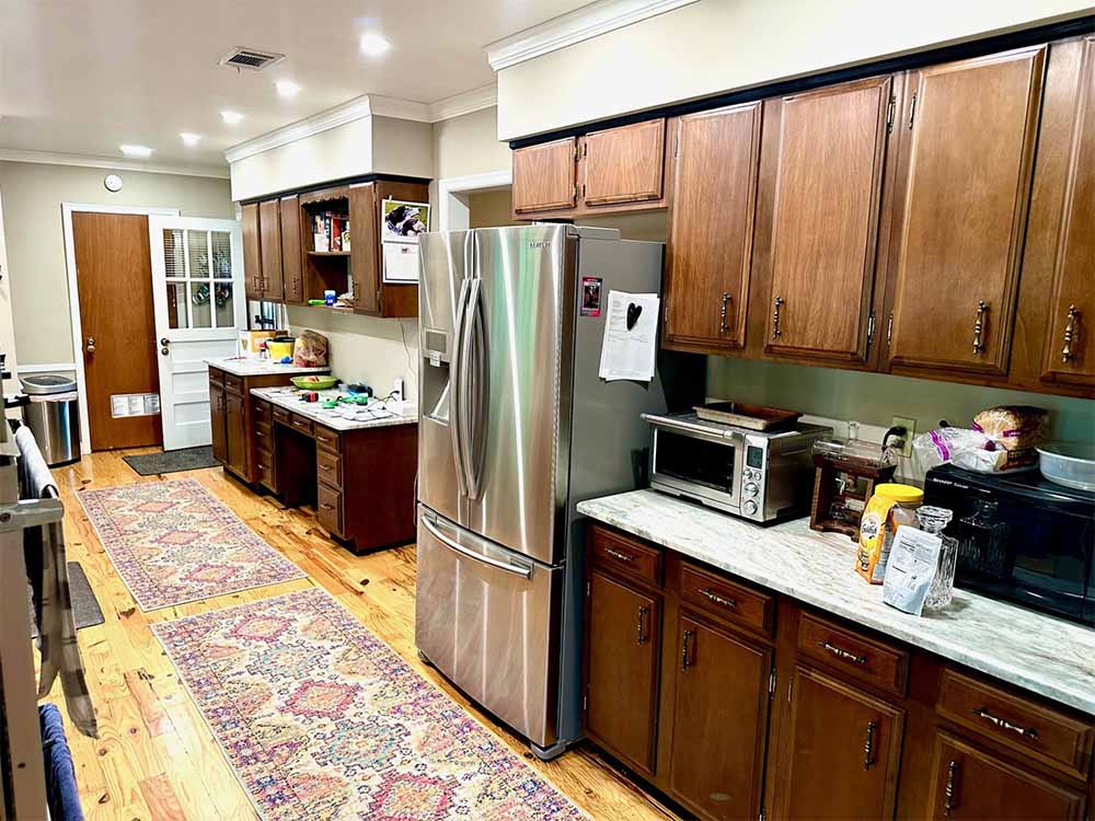 Formal dining room with large windows and original wood floors