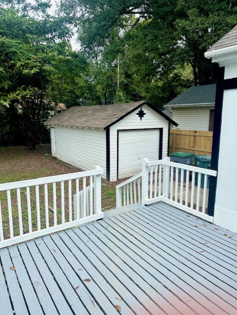 Exterior of beautifully remodeled Memphis home with fenced yard and decking.