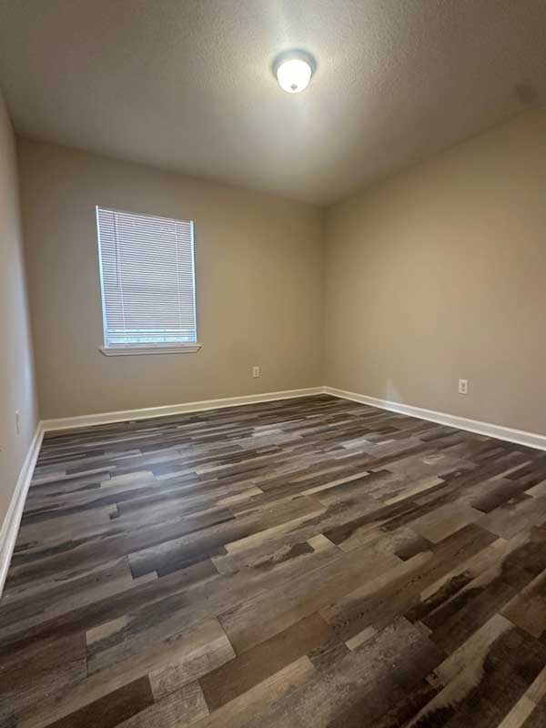 Updated floors and freshly painted walls in fully rehabbed Memphis home for sale.