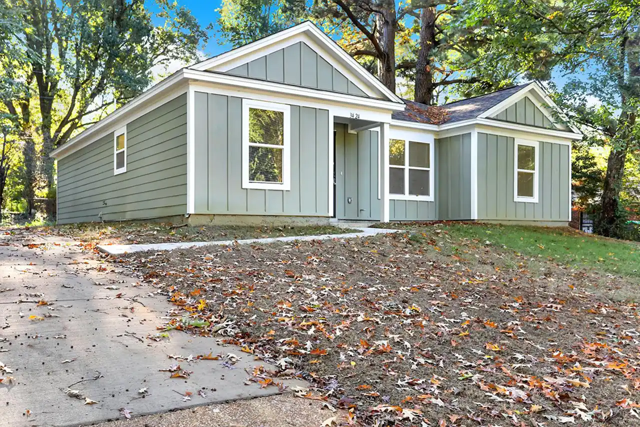 Newly built 4-bedroom home with fresh exterior and covered carport at 5046 Breckenwood Drive in Memphis