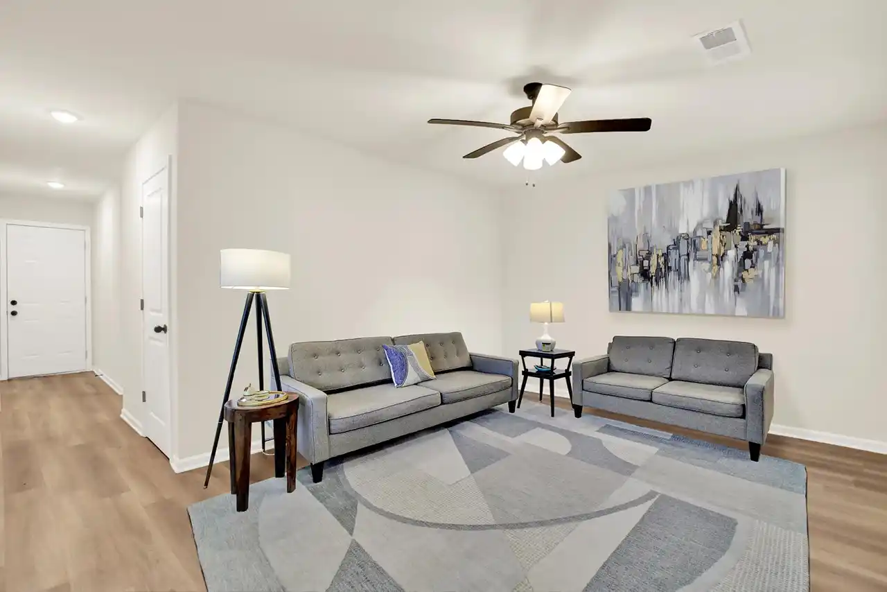 Living area staged with furniture, highlighting potential layout for residents