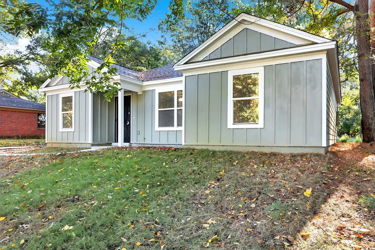 Front angle of newly built Memphis home showing carport, landscaping and curb appeal