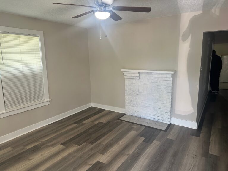 Bright living room with fresh paint and luxury vinyl flooring