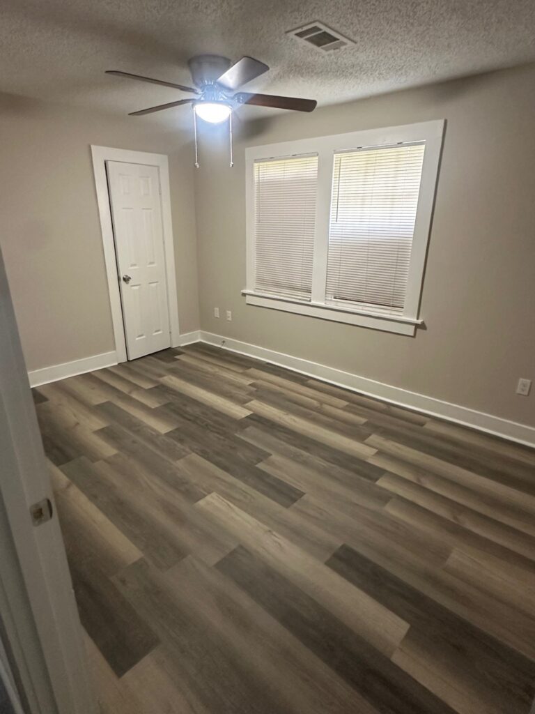 Bright living room with fresh paint and luxury vinyl flooring