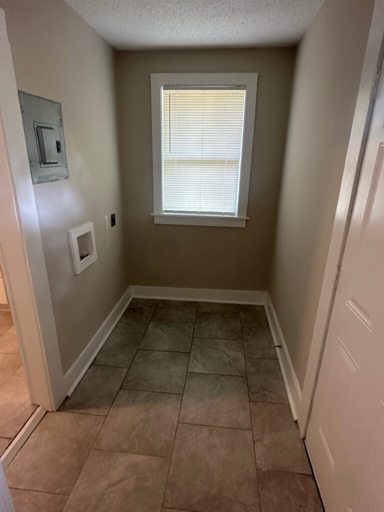 Renovated laundry area for washer and dryer.