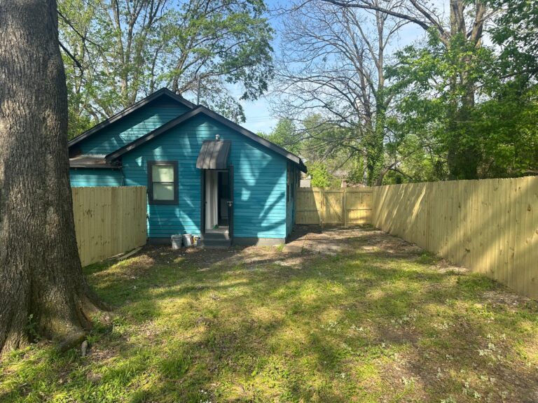 Side angle showing new exterior paint and HVAC units