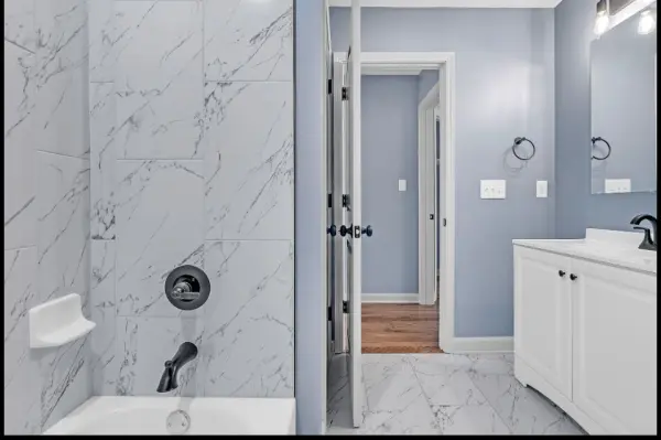 Tile tub and shower combo with updated fixtures in Memphis investment home for sale 38107