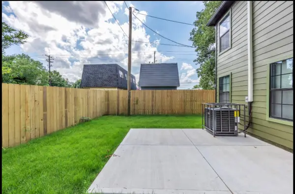 Backyard with concrete patio and HVAC unit in Memphis investment property for sale 38107
