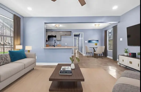 Staged living room with open concept design in Memphis investment home for sale 38107