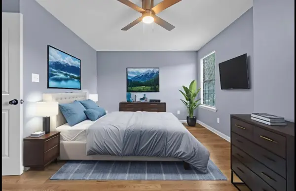 Staged bedroom with hardwood floors and modern decor in Memphis investment home for sale 38107