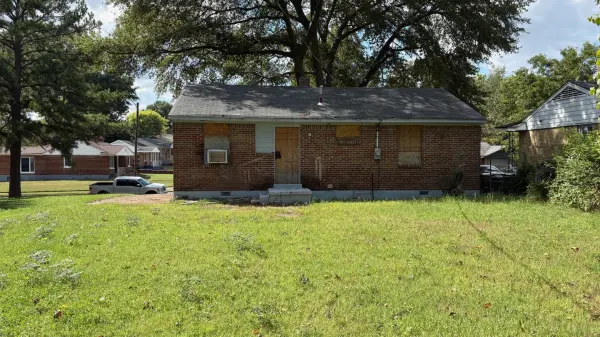 Rear exterior of Memphis TN 38106 home with renovation potential