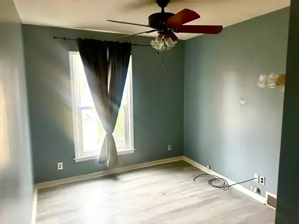 Kitchen area with upper cabinetry and potential for modern upgrades