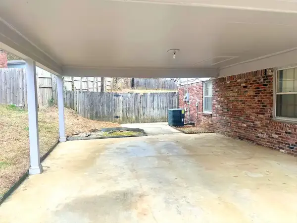 Exterior side view showing well-maintained siding and landscaping potential