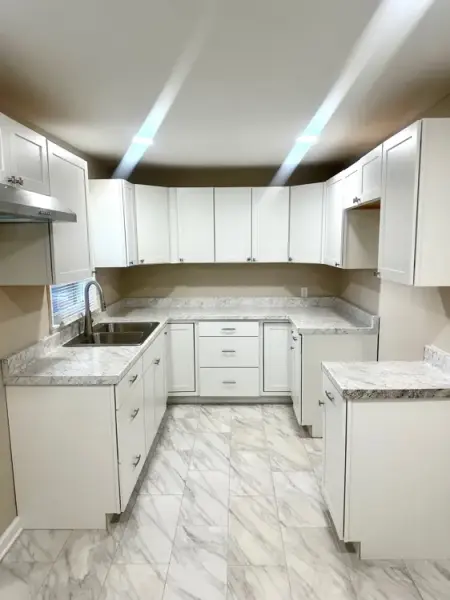 Dining area with tile flooring and large window in Memphis rental property