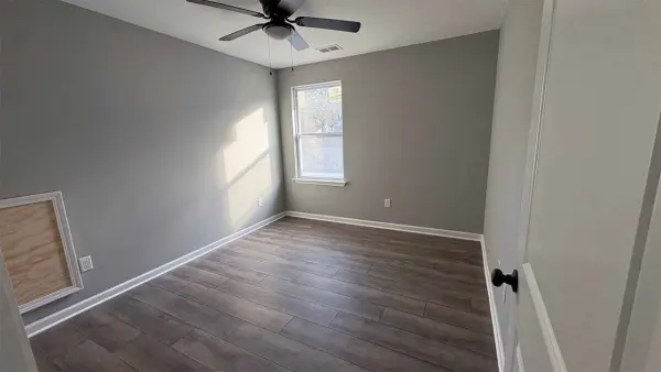 Master suite with double closets and ceiling fan