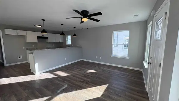 Living room with modern lighting and open floor plan