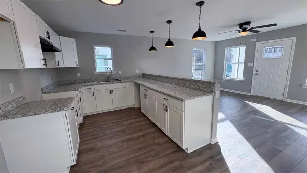 Bright kitchen with stainless steel appliances and granite countertops