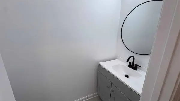 Bathroom with modern vanity and designer tile surround