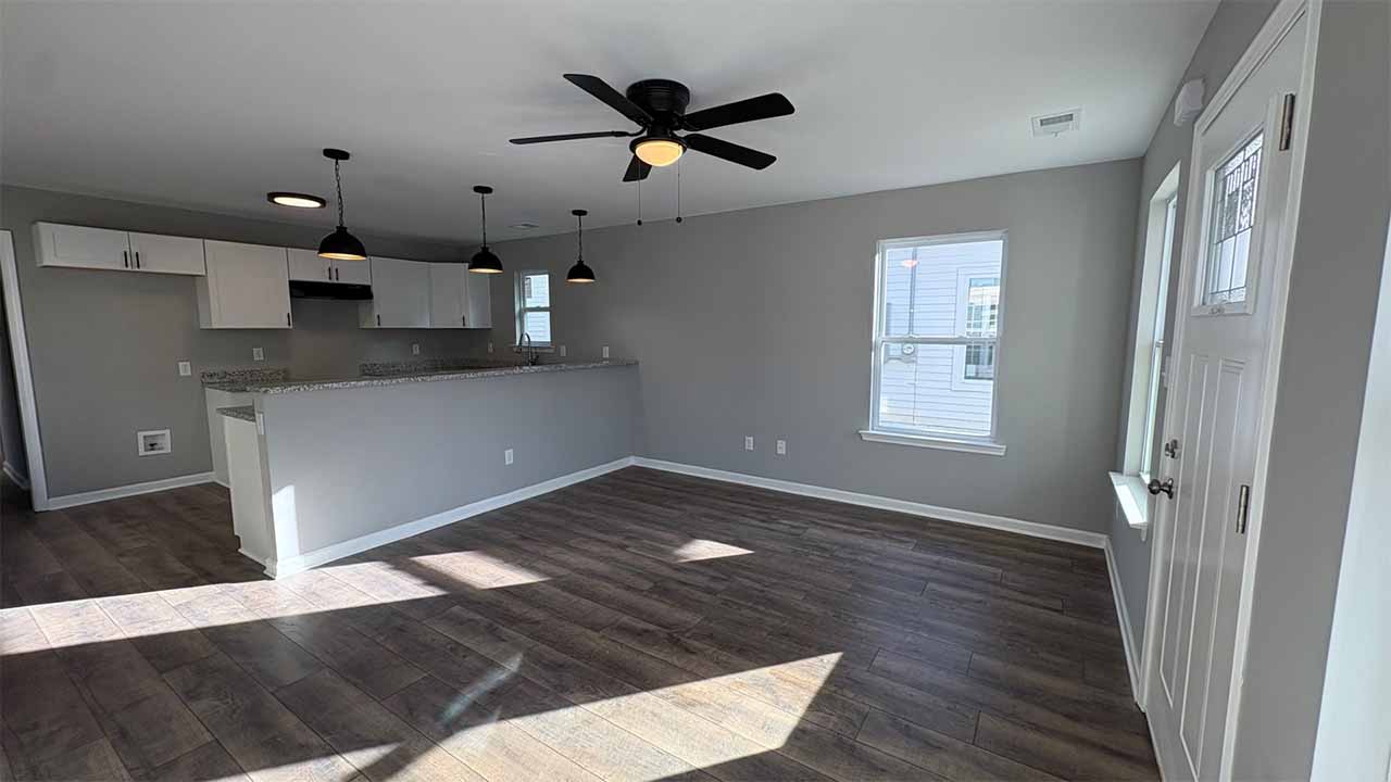 Living room with modern lighting and open floor plan