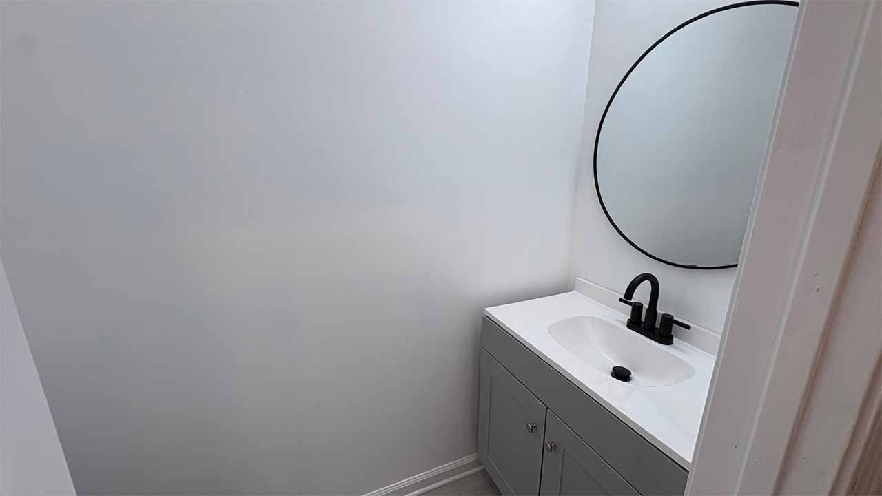 Bathroom with modern vanity and designer tile surround