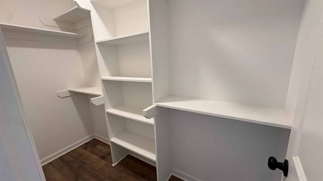 Elegant lighting and modern backsplash in kitchen