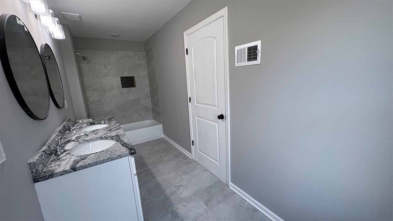 Staircase view showing luxury flooring and trim