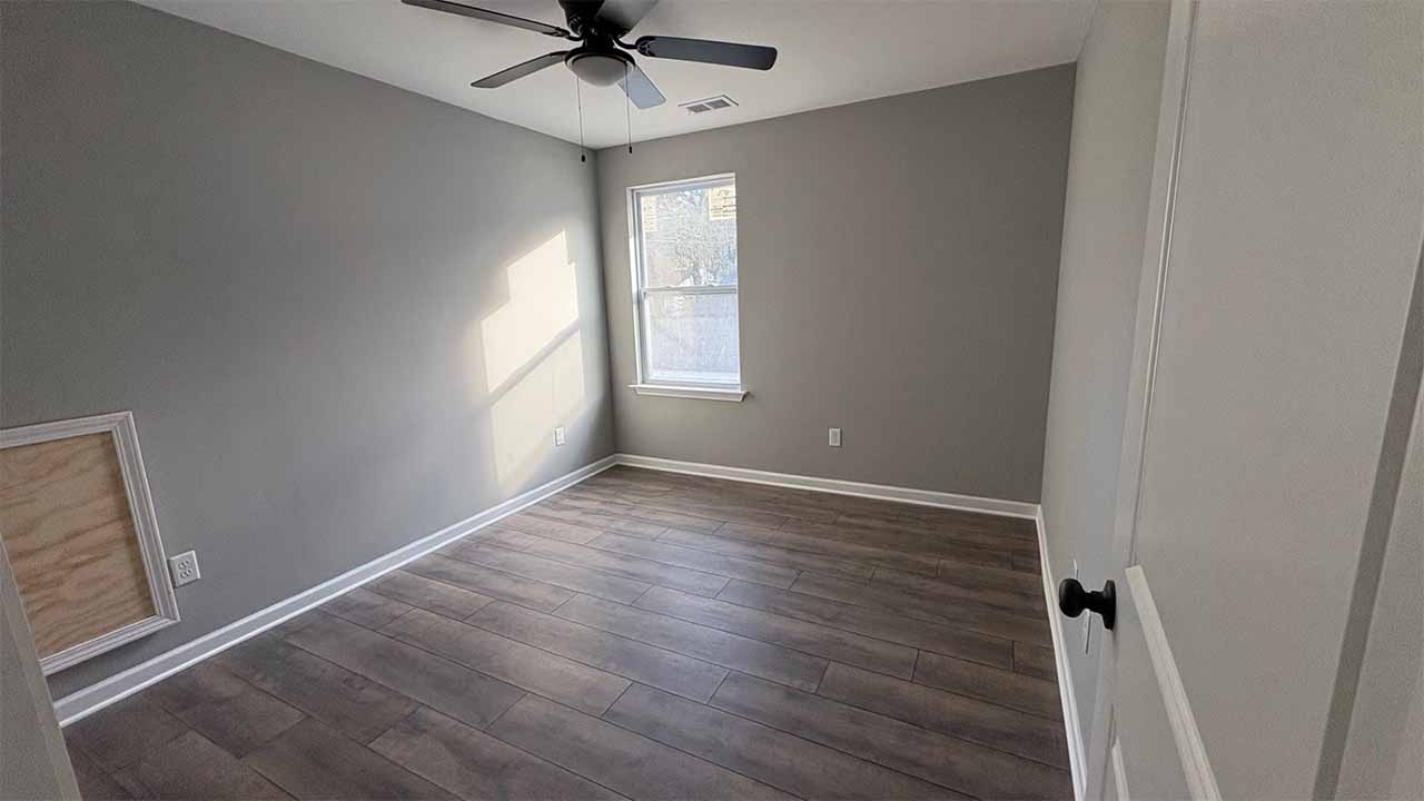 Master suite with double closets and ceiling fan