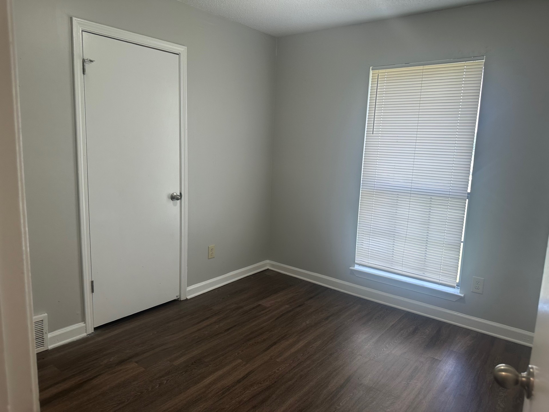 Living Room with New Flooring and Fresh Paint in Memphis Home for Sale